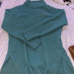 green sweater/turtle neck